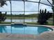 Relaxing pool area overlooking a tranquil lake at 1949 Tiptree Cir, Orlando, FL 32837