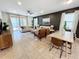 Open-concept living room with comfortable seating and dining area at 1921 Nice Ct, Kissimmee, FL 34747