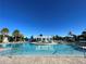 Resort-style pool with water features and lounge chairs at 1921 Nice Ct, Kissimmee, FL 34747