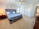 Bright bedroom with a queen-size bed and ample closet space at 1921 Nice Ct, Kissimmee, FL 34747