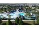 Aerial view of community pool and surrounding neighborhood at 1921 Nice Ct, Kissimmee, FL 34747