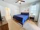 Second bedroom with king bed, dresser, and neutral decor at 1921 Nice Ct, Kissimmee, FL 34747