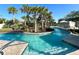 Relaxing lazy river pool with lush landscaping and shaded seating at 1921 Nice Ct, Kissimmee, FL 34747