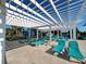 Poolside lounge area with shaded pergola and comfortable seating at 1921 Nice Ct, Kissimmee, FL 34747