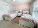 Twin bedroom with pink color scheme and unicorn wall decor at 1921 Nice Ct, Kissimmee, FL 34747