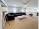 Open living space featuring a sectional sofa and large windows at 1921 Nice Ct, Kissimmee, FL 34747