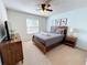 Full size bed in bright bedroom with window and closet at 1921 Nice Ct, Kissimmee, FL 34747