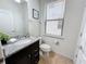 Small bathroom with granite vanity and toilet at 1921 Nice Ct, Kissimmee, FL 34747