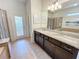 Elegant bathroom with a double vanity, soaking tub and walk-in shower at 1921 Nice Ct, Kissimmee, FL 34747