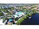 Community resort-style pool with waterslides, a playground, and a lake at 1921 Nice Ct, Kissimmee, FL 34747