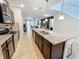 Modern kitchen with stainless steel appliances and breakfast bar at 1921 Nice Ct, Kissimmee, FL 34747