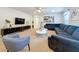 Large living area with sectional sofa and two coffee tables at 1921 Nice Ct, Kissimmee, FL 34747