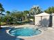 Community hot tub with palm trees and gazebo nearby at 1921 Nice Ct, Kissimmee, FL 34747