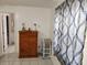 Bedroom with wood dresser and blue patterned curtains at 2518 Bowmer Dr, Kissimmee, FL 34744