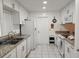 Bright eat-in kitchen, featuring granite countertops and white cabinetry at 2518 Bowmer Dr, Kissimmee, FL 34744