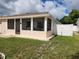 Neat and well-maintained home with a screened-in porch and fenced yard at 2518 Bowmer Dr, Kissimmee, FL 34744