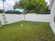 Backyard with grassy lawn and white vinyl fence at 2518 Bowmer Dr, Kissimmee, FL 34744