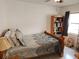 Guest bedroom with a wooden sleigh bed and ceiling fan at 2518 Bowmer Dr, Kissimmee, FL 34744