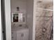 Updated bathroom with a white vanity and marble shower at 2518 Bowmer Dr, Kissimmee, FL 34744