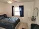 Spacious bedroom with a queen-size bed and built-in shelving at 2518 Bowmer Dr, Kissimmee, FL 34744