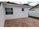 Small tiled patio adjacent to the house at 2518 Bowmer Dr, Kissimmee, FL 34744