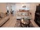 Spacious living room with comfortable seating and views into the kitchen and dining area at 2518 Bowmer Dr, Kissimmee, FL 34744