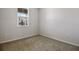 Simple bedroom with neutral walls and carpet at 1456 August Gray Dr, Kissimmee, FL 34744