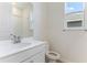 Clean bathroom with white vanity, toilet, and shower/tub combo at 2027 Stetson Ct, Eagle Lake, FL 33839