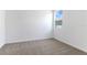 Spacious bedroom with carpeted floor and large window at 2027 Stetson Ct, Eagle Lake, FL 33839