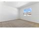 Well-lit bedroom with neutral carpet and double window at 2027 Stetson Ct, Eagle Lake, FL 33839