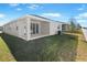 Well-maintained home with covered patio and lawn at 2027 Stetson Ct, Eagle Lake, FL 33839