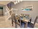 Dining room with a table for six and a view of the staircase at 3725 Pacific Ln, Davenport, FL 33897