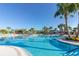 Expansive resort-style pool with surrounding lounge chairs at 3725 Pacific Ln, Davenport, FL 33897