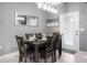 Bright dining area with a table for six, and access to a backyard at 3725 Pacific Ln, Davenport, FL 33897