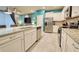 Spacious kitchen featuring granite countertops, stainless steel appliances, and ample cabinetry at 3725 Pacific Ln, Davenport, FL 33897