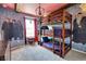 Triple bunk beds in a themed bedroom with Harry Potter decor at 3725 Pacific Ln, Davenport, FL 33897