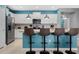 Modern kitchen with white cabinets and granite island at 3725 Pacific Ln, Davenport, FL 33897