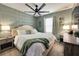 Bedroom with king-size bed, ceiling fan, and unique wall decor at 3725 Pacific Ln, Davenport, FL 33897