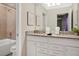 Bathroom with granite countertop, white cabinets, and a shower/tub at 3725 Pacific Ln, Davenport, FL 33897