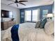 Bedroom with king-size bed, dresser, and ceiling fan at 3725 Pacific Ln, Davenport, FL 33897