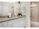 Bathroom with granite countertop, white cabinets, and a shower at 3725 Pacific Ln, Davenport, FL 33897