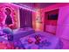 Two twin beds in a themed bedroom with a mural and accent lighting at 3725 Pacific Ln, Davenport, FL 33897