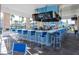 Outdoor community bar with multiple TVs and seating at 3725 Pacific Ln, Davenport, FL 33897