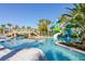 Large, resort-style pool with water features and plenty of lounge chairs at 3725 Pacific Ln, Davenport, FL 33897