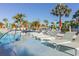 Relaxing pool area with multiple lounge chairs at 3725 Pacific Ln, Davenport, FL 33897