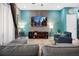 Living room showcasing a large TV, comfortable seating and a stylish accent wall at 3725 Pacific Ln, Davenport, FL 33897