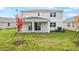 Home with covered patio and grassy backyard at 1413 August Gray Dr, Kissimmee, FL 34744