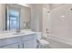 Clean bathroom with white vanity, bathtub, and shower at 1413 August Gray Dr, Kissimmee, FL 34744