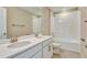 Bathroom with double vanity and a bathtub shower combo at 1413 August Gray Dr, Kissimmee, FL 34744