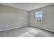 Spacious bedroom with a large window and grey carpet at 1413 August Gray Dr, Kissimmee, FL 34744